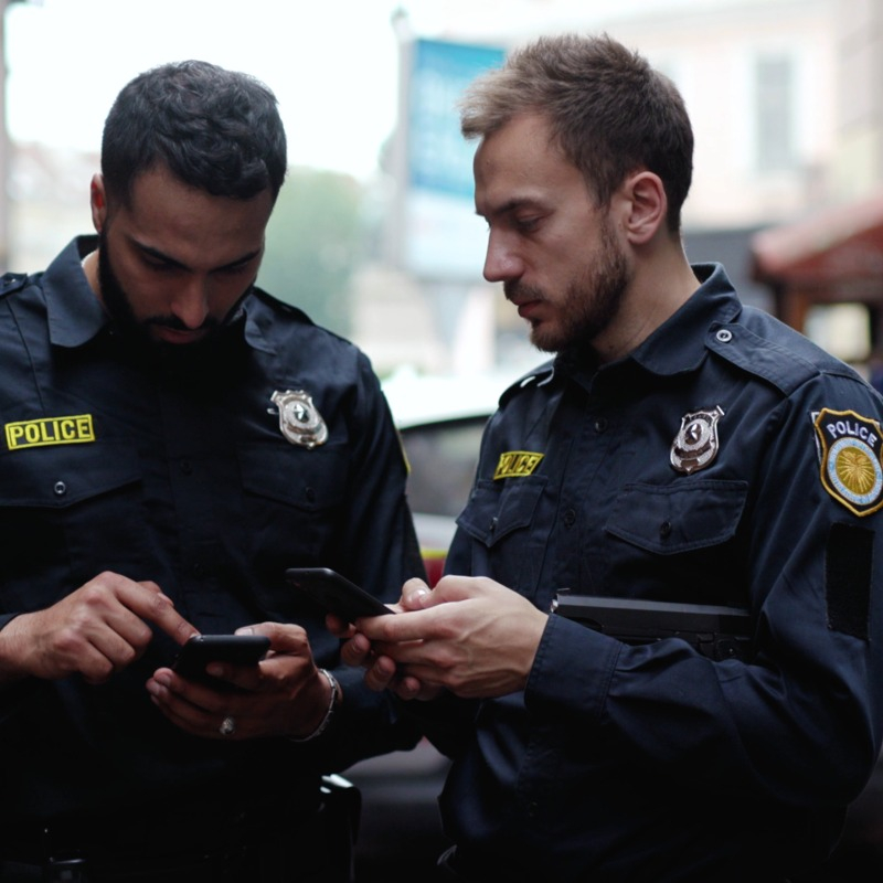 Two Police Officers on Phone