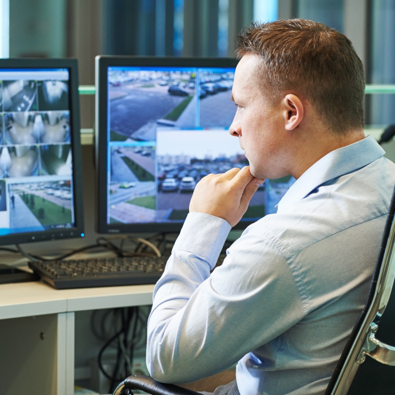 Security Guard Watching Cameras